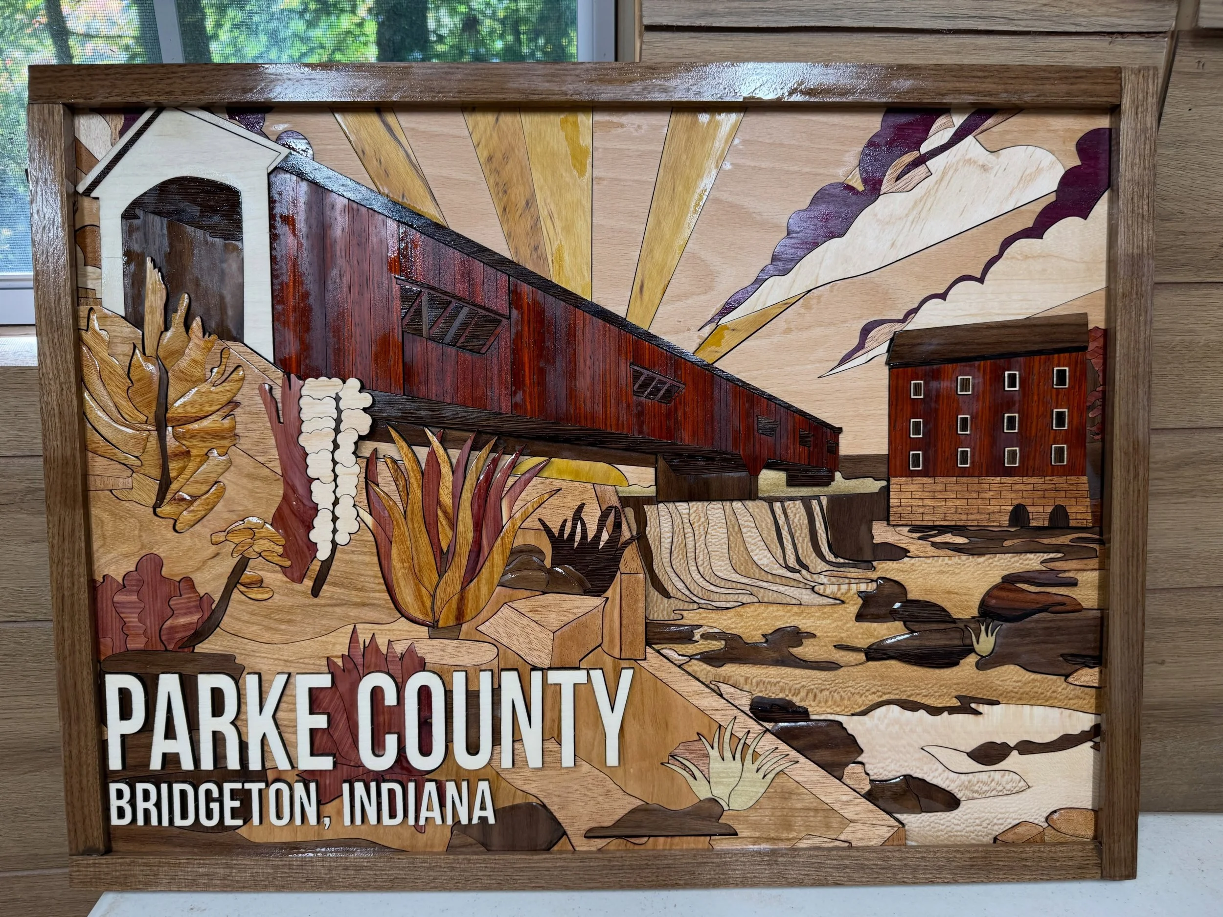 Final piece finished for the Covered Bridge Festival starting this weekend! Very proud of this piece&hellip; 24x18 and 460ish pieces. 12 different hardwoods : Aspen, Bolivian Rosewood, Canarywood, Cherry, Maple, Mahogany, Paduk, Purpleheart, Red Ceda