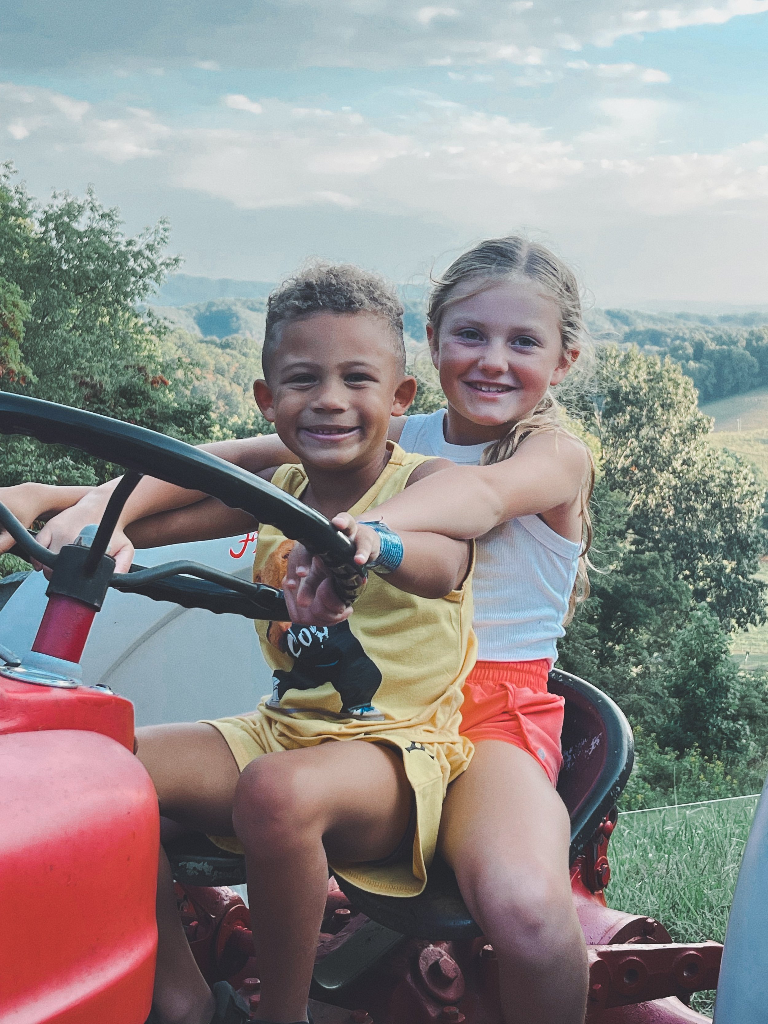 two kids on tractor.jpeg