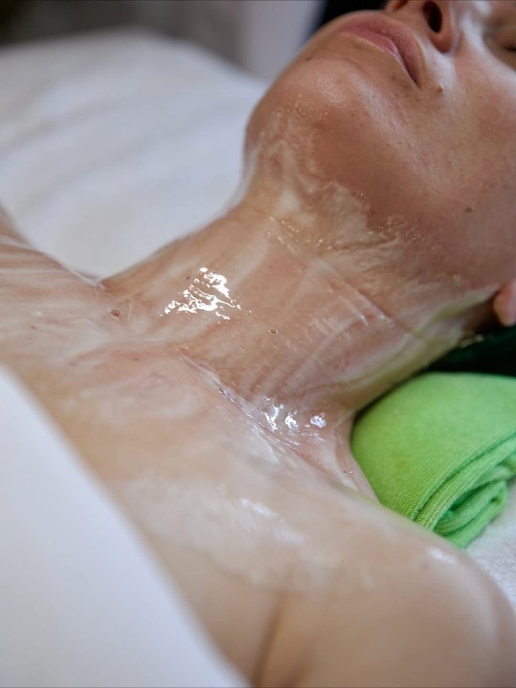 A client wearing a DMK Enzyme Therapy masque at SKYN