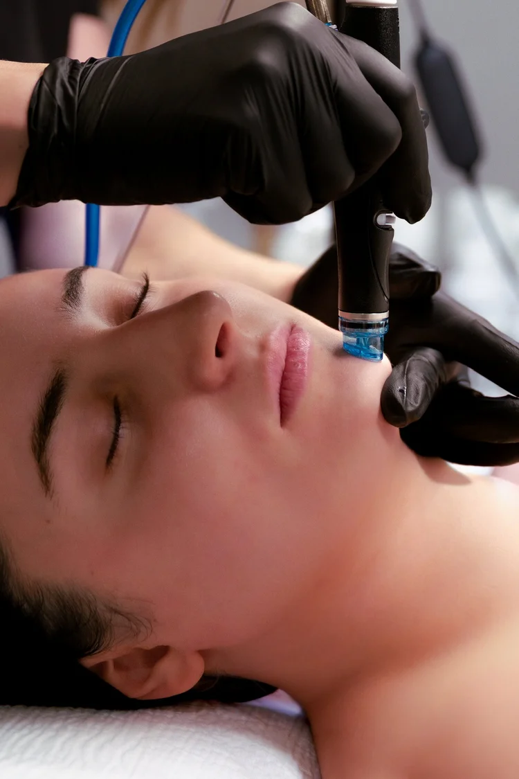 A client relaxing during a HydraFacial at SKYN
