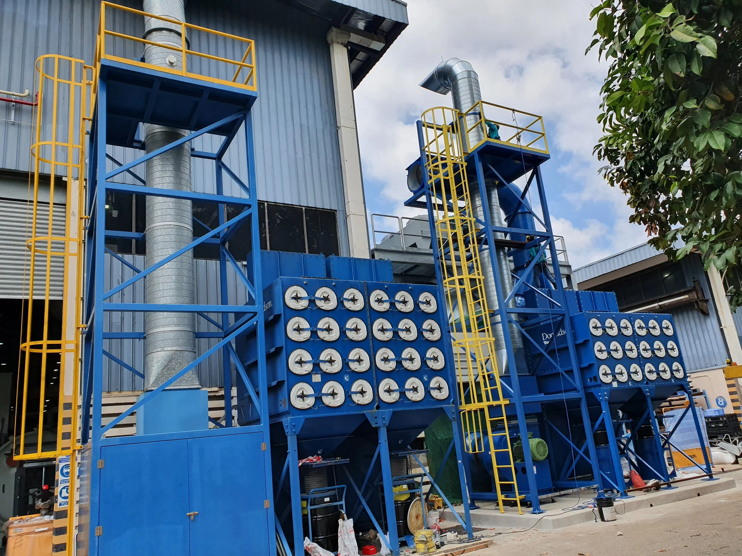 Central dust collector unit installed outside a Singapore factory