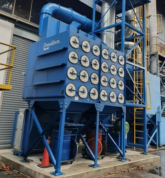 Explosion protected dust collector serving a thermal spray facility