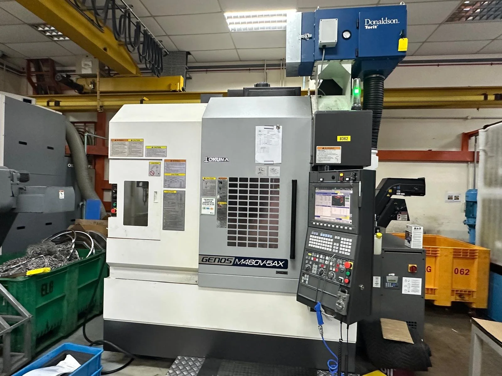 Machine-mounted oil mist collector fitted directly to a CNC machining centre
