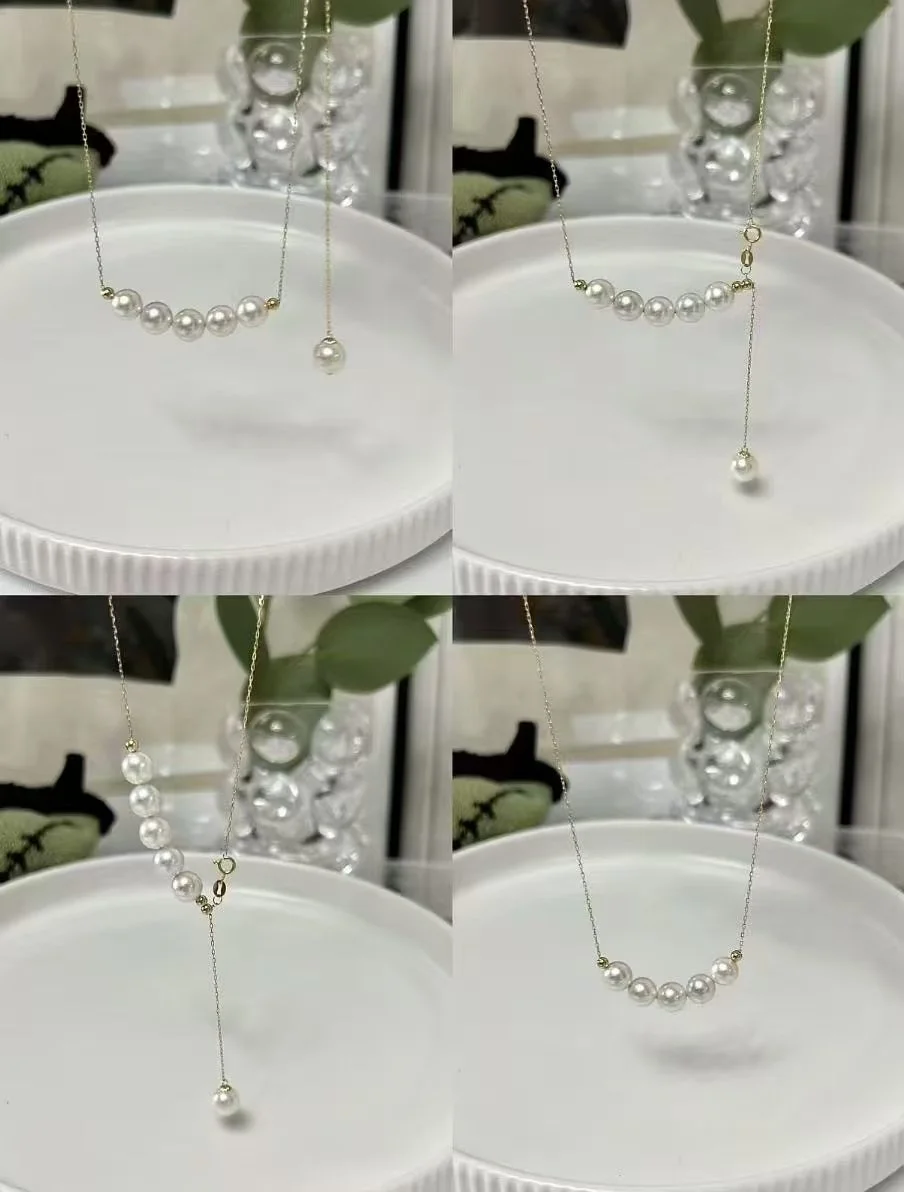 A pearl necklace with a sliding drop pendant displayed on a white round dish with a decorative background.