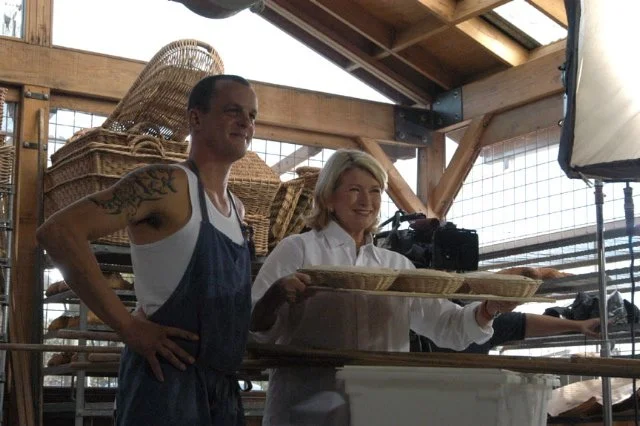 Aaron Weber and Martha Stewart standing inside the ranch back house.