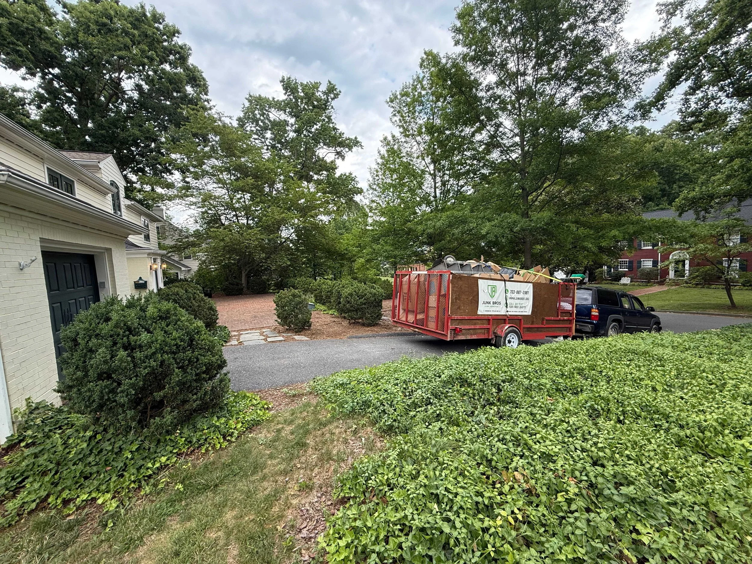 Junk Bros junk removal trailer at a residential property in Augusta County, Virginia