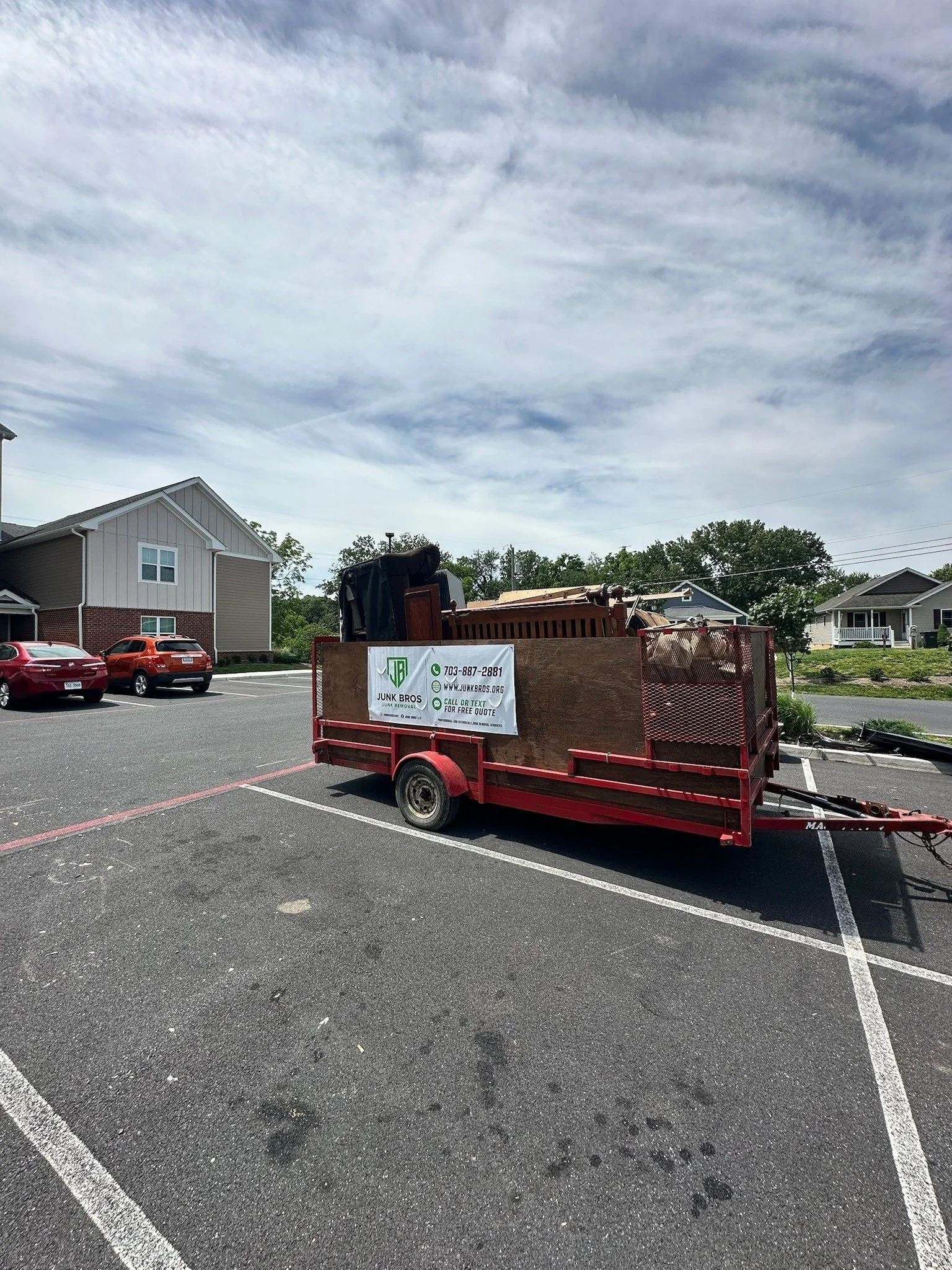 Junk Bros trailer at a junk removal job in Prince William County, Virginia