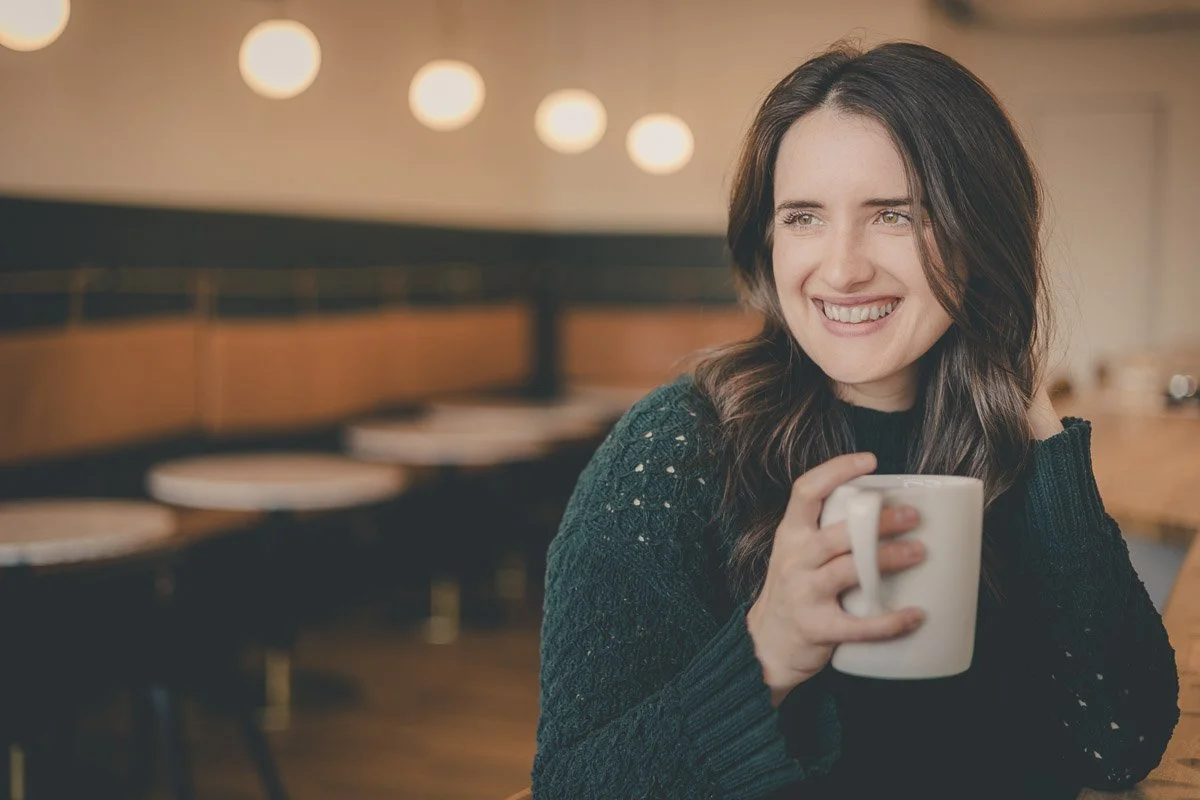 woman posing for a portrait in coffee shop