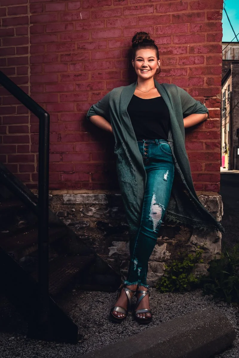 female senior portrait session in alley