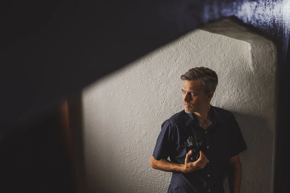 dramatic self portrait with bold lighting indoors