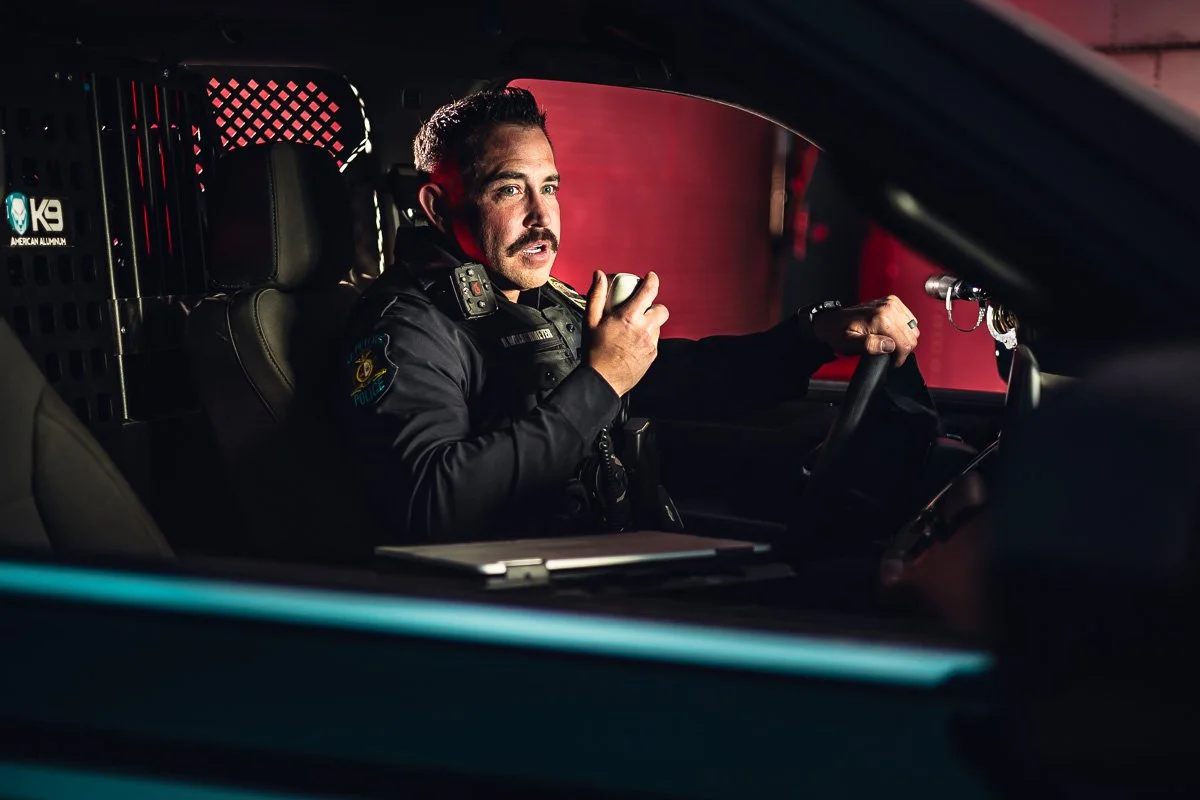 dramatic portrait of police officer talking on radio