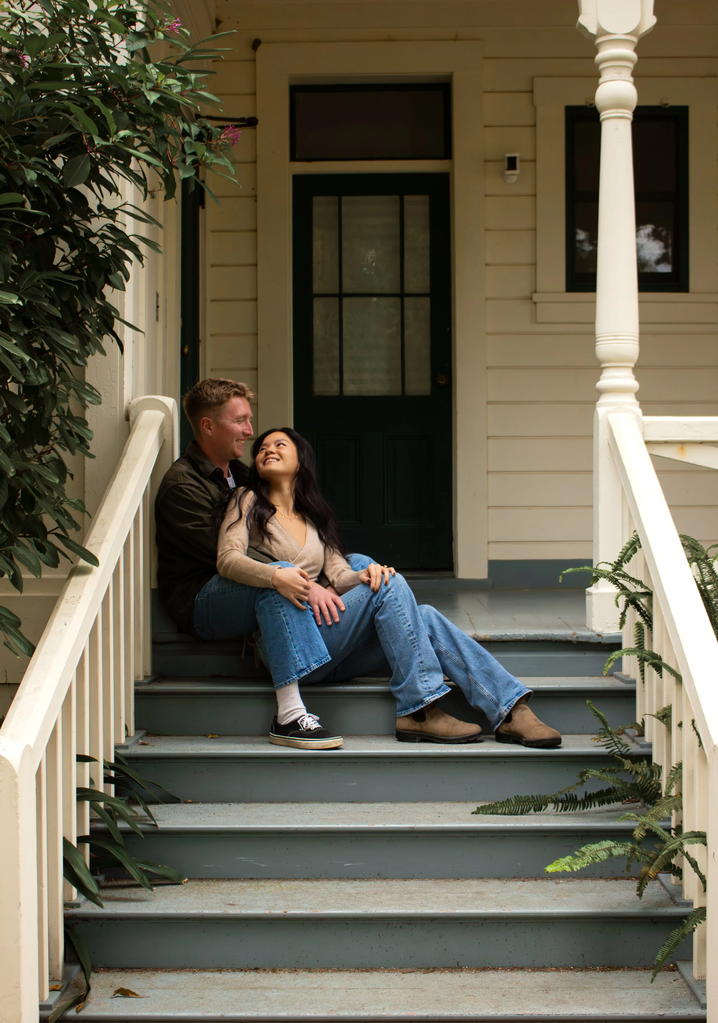 Couple leaning into each other during engagement session 