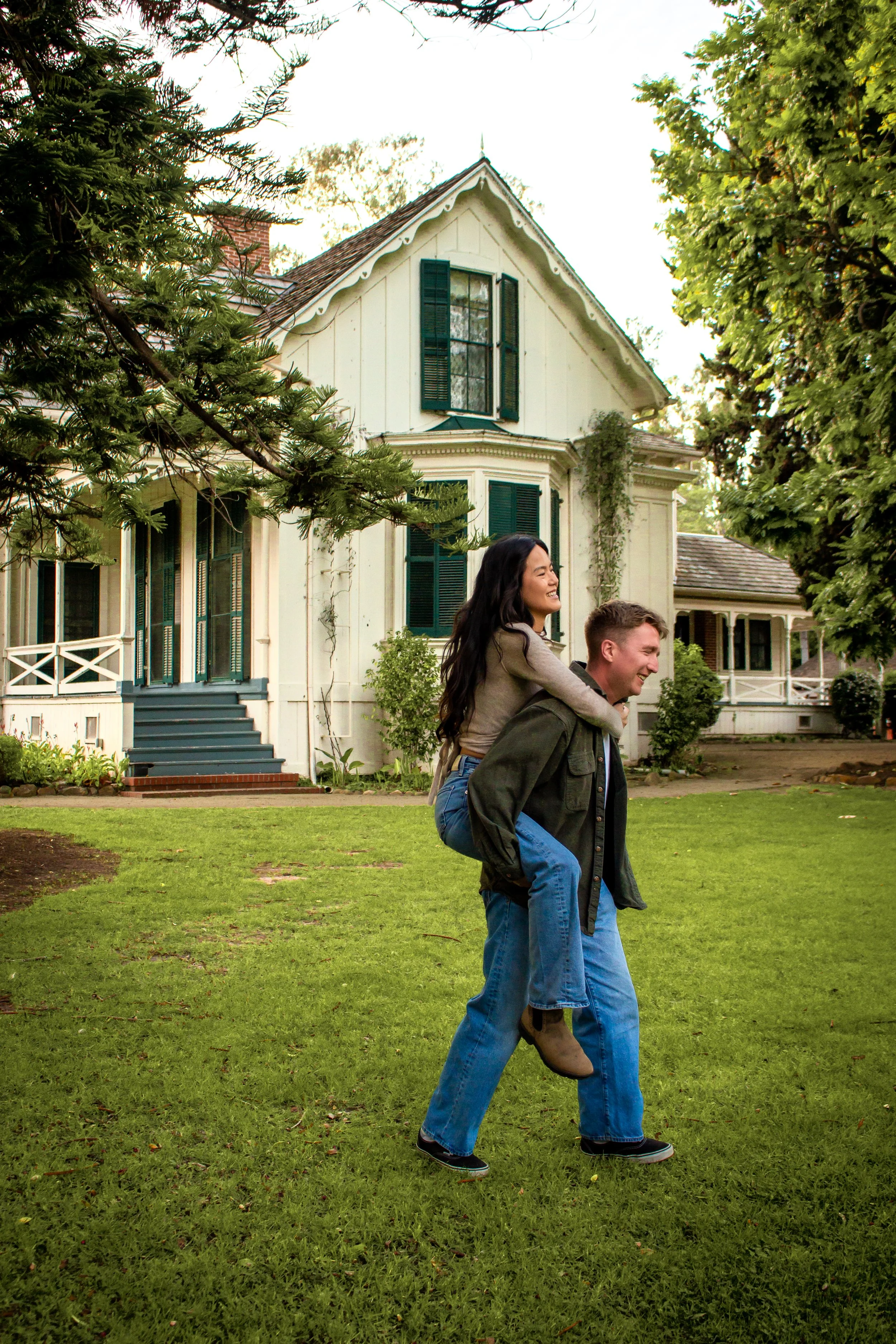 Engaged couple laughing in natural light during a wedding photoshoot