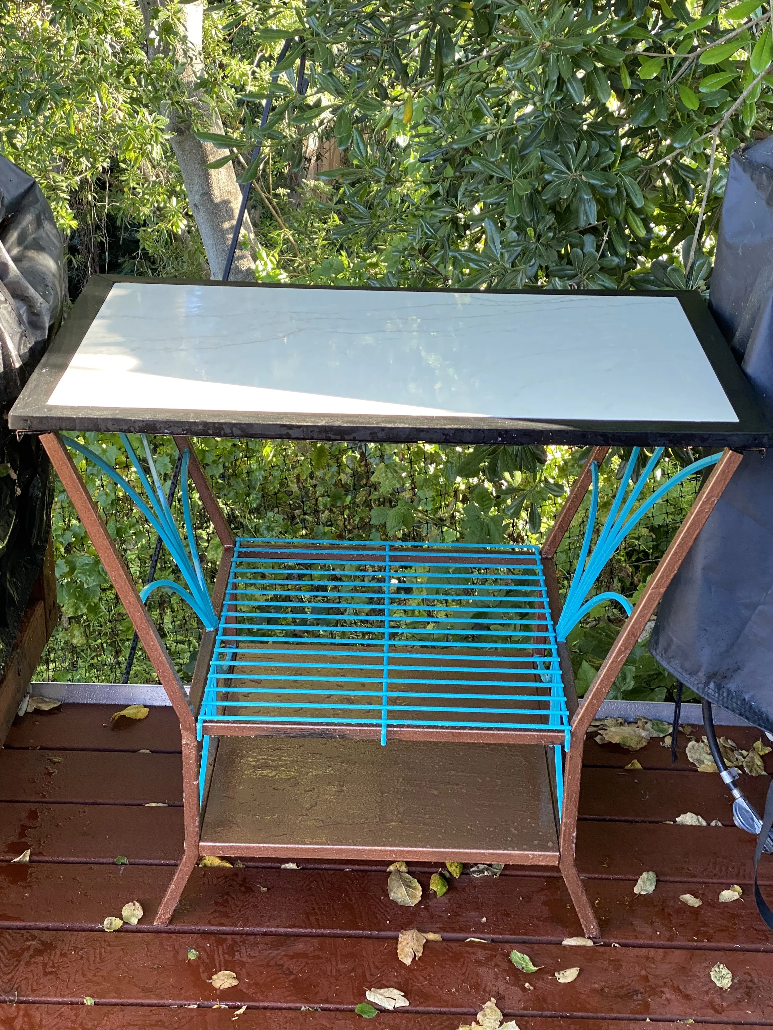 Rescued from trash outdoor table repurposed with marble slab as top perfect for outdoor pizza kitchen