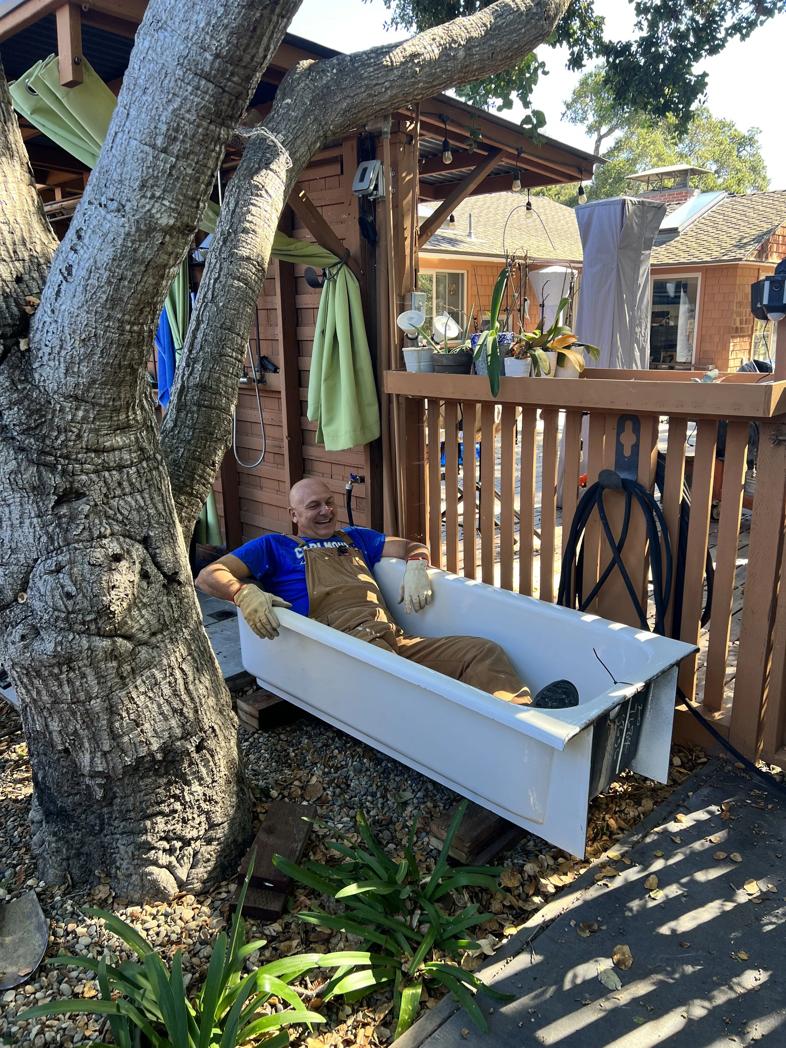 Tub placed to optimize bathing under the oaks and starts near hot water source