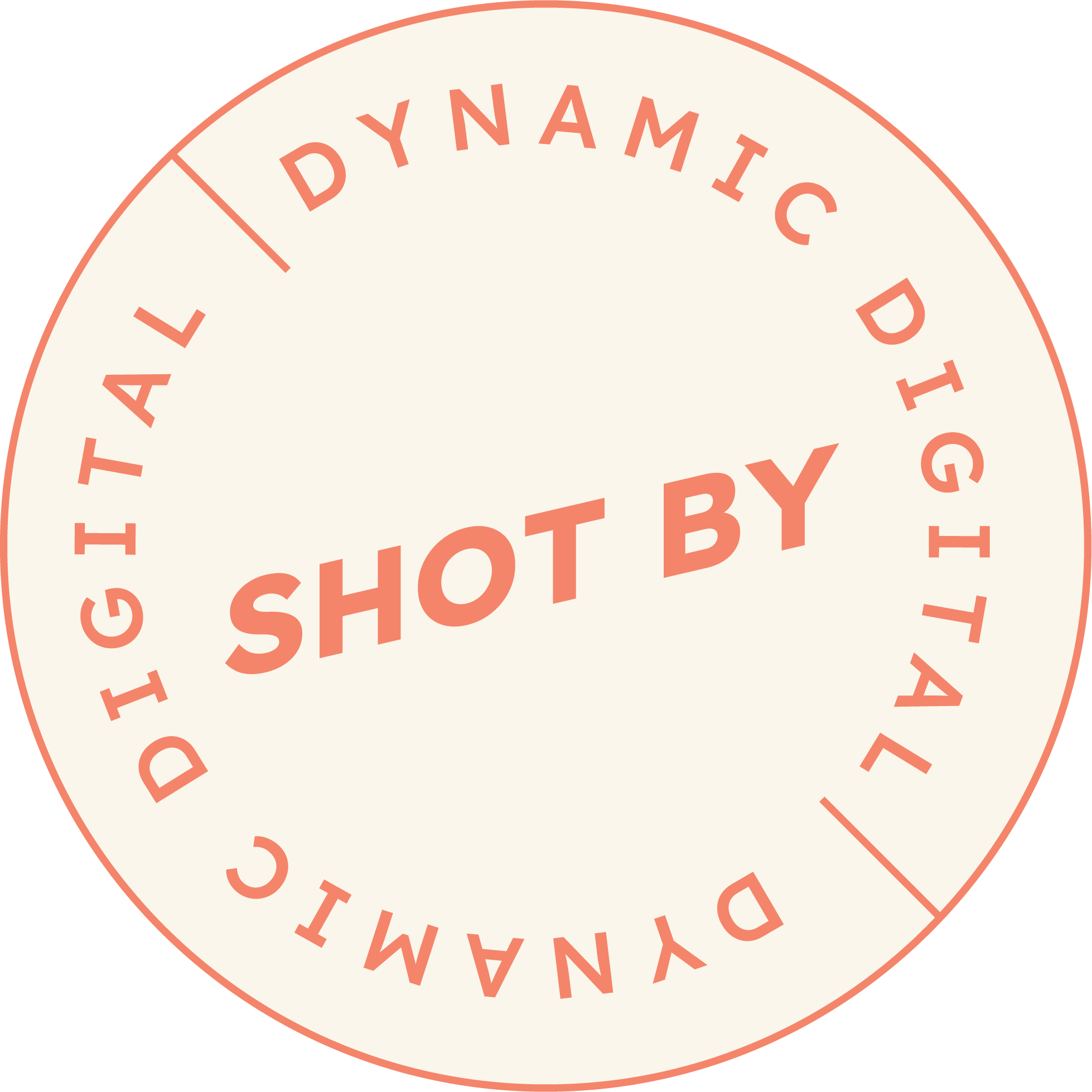 Circular stamp with red text on a cream background, stating "Shot By" in the center and "DYNAMIC DIGITAL IMAGING" around the circumference.