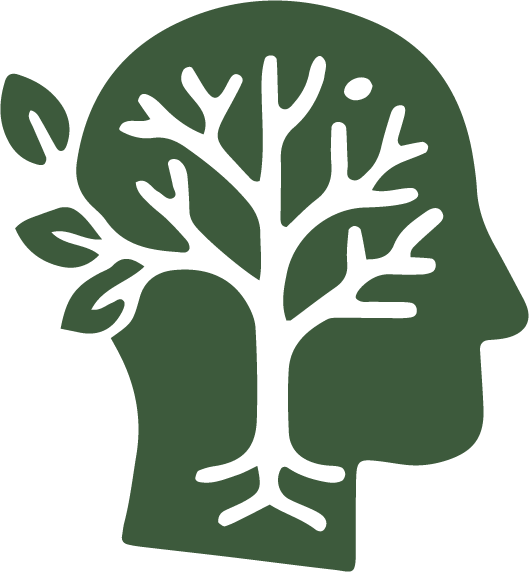 A green silhouette of a human head with a tree growing inside it, representing mental health or growth.