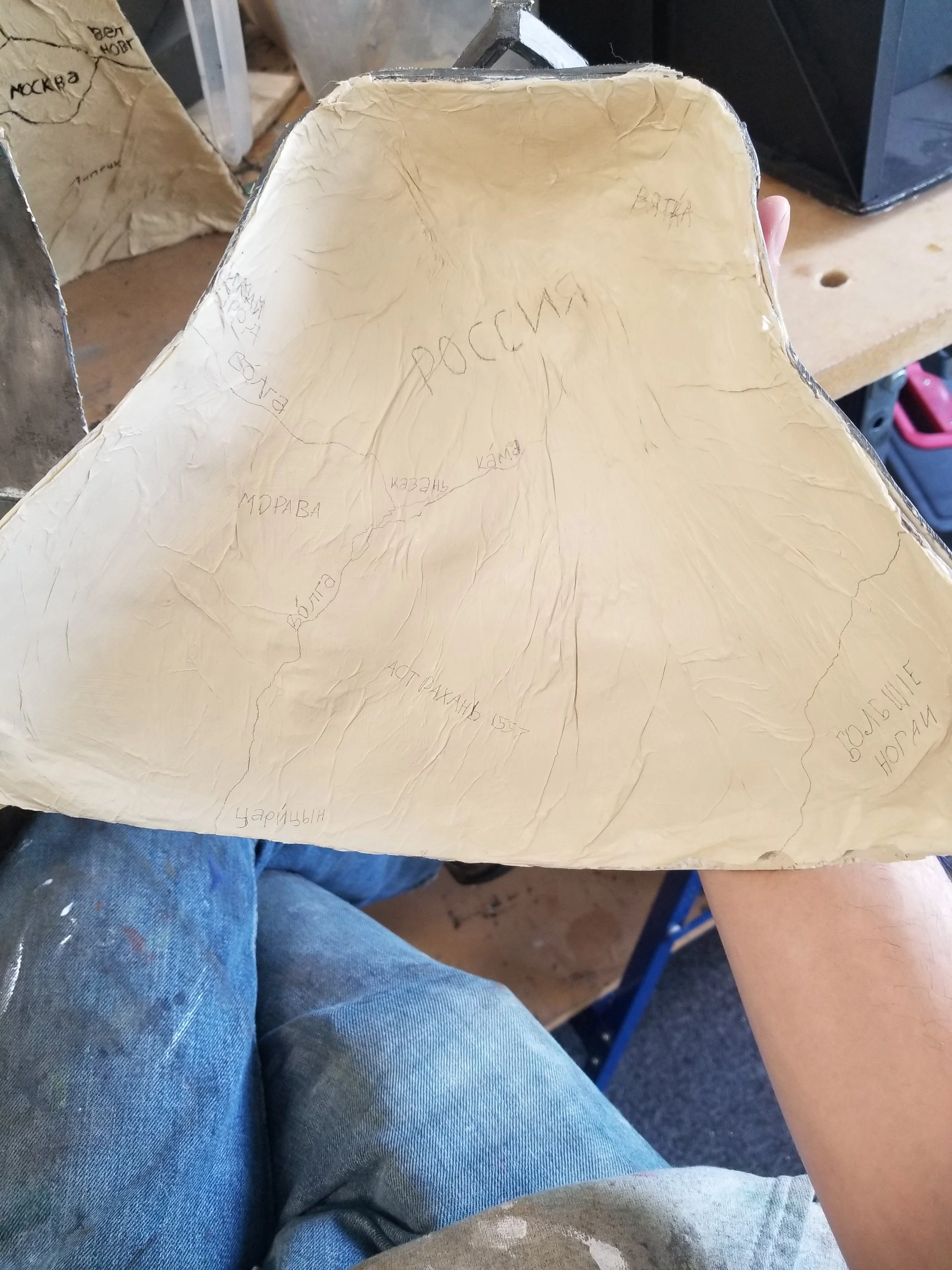 Crepe Paper used for decoupage on interior of bell to create a folded map texture