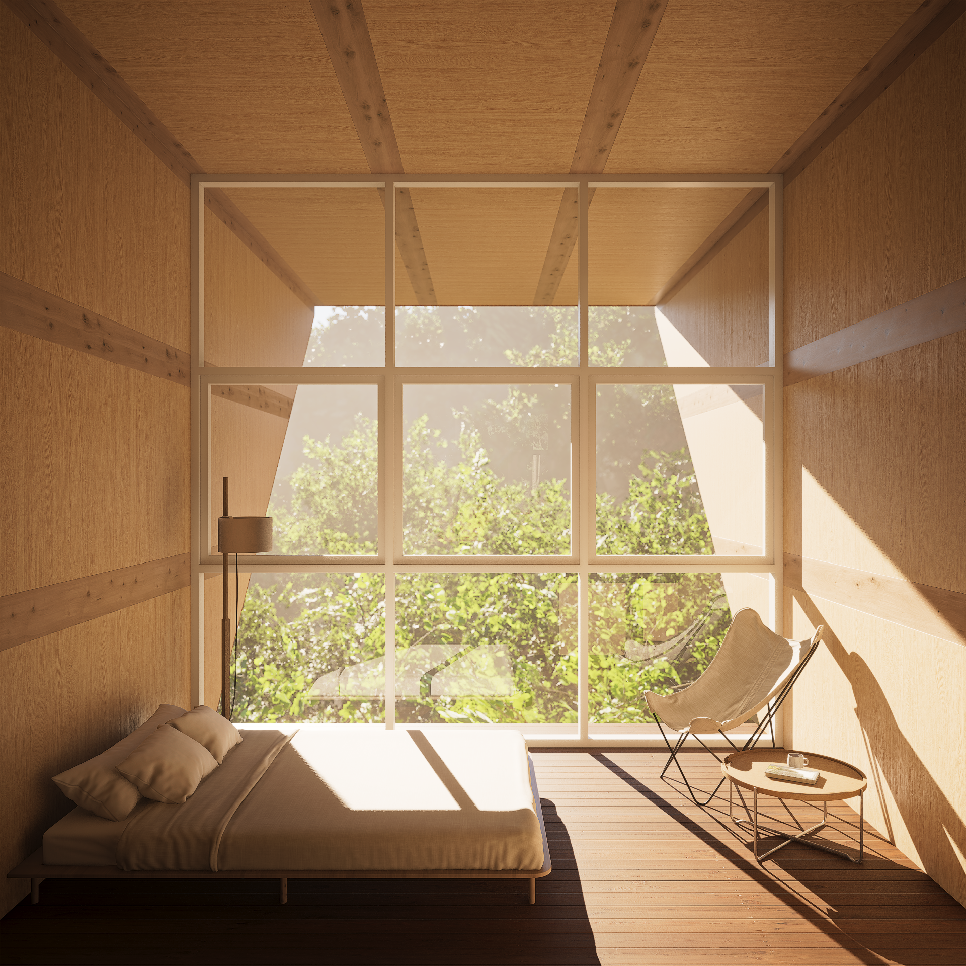 Minimalist bedroom with large window showing green trees, bed with beige bedding, bedside lamp, and a chair with a side table holding a coffee mug and book.