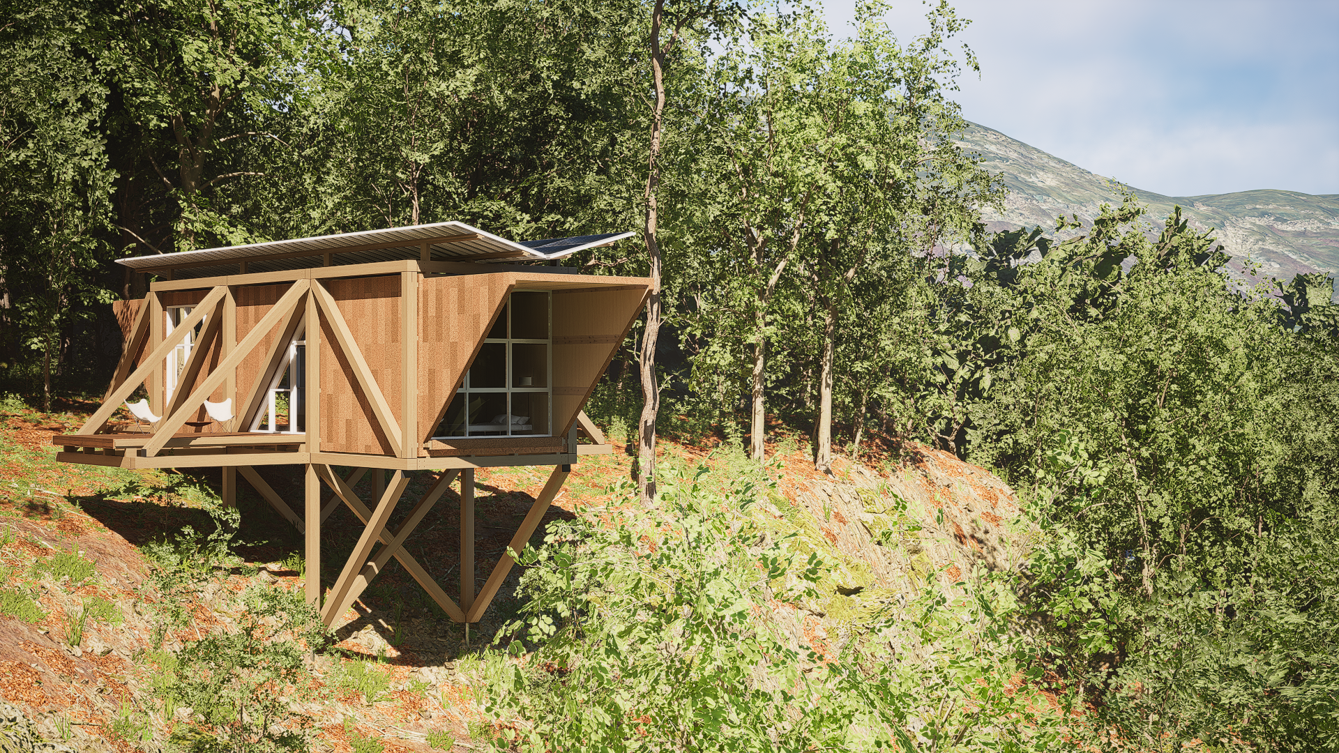 A modern house built on stilts on a hillside surrounded by trees and mountains in the background.