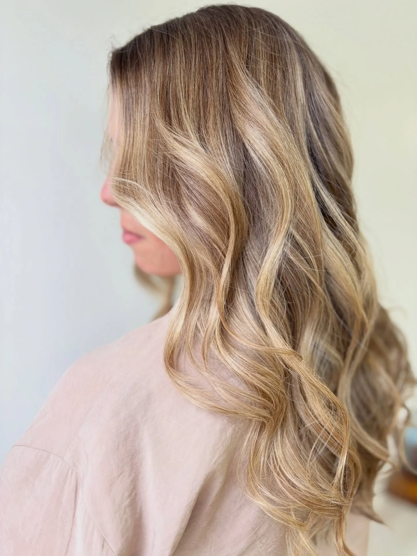 The grey-blending balayage results and process, but what does that look like for you? 

With a balayage, the highlights are painted in a sweeping upwards motion, maintaining more depth at the root, lots of dimension, and brightness at the ends. 

If 