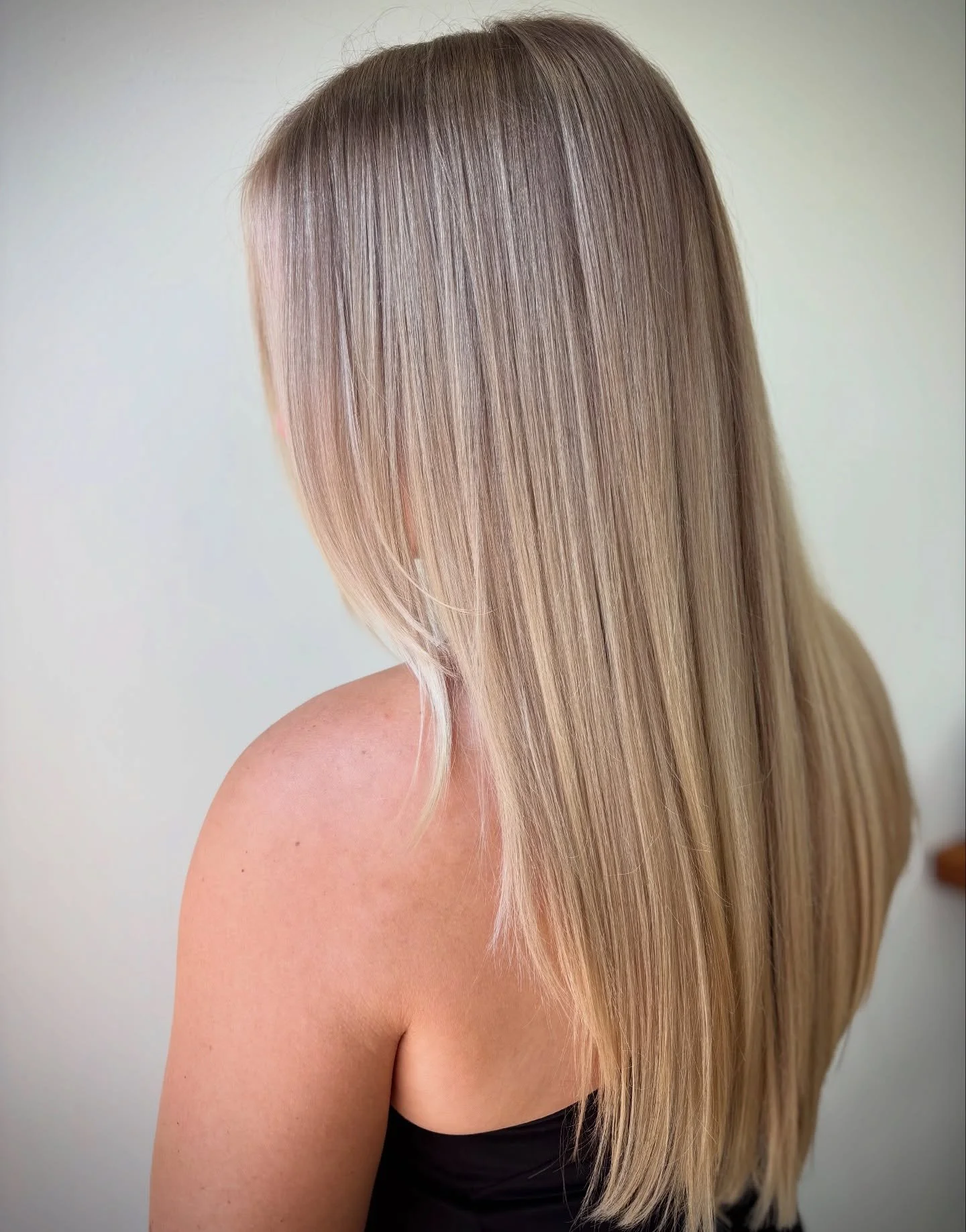 When I first met Cassidy, the goal was to work through harsh highlights with chunky lowlights to create a soft, blended, low-maintenance blonde. We have come such a long way together since February of 2023!

To keep her blonde hair long and healthy, 