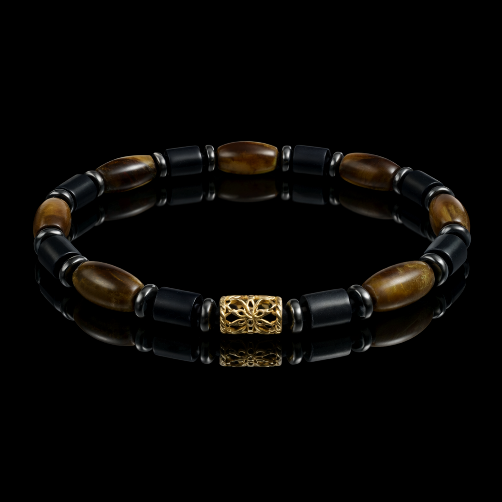 Black and brown beaded bracelet with a gold decorative clasp on a black background.
