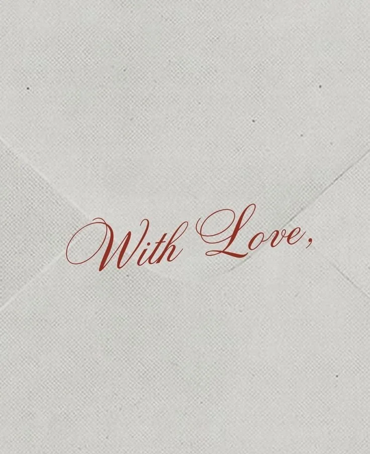 A card with the words "With Love" written in elegant script on a textured white background.