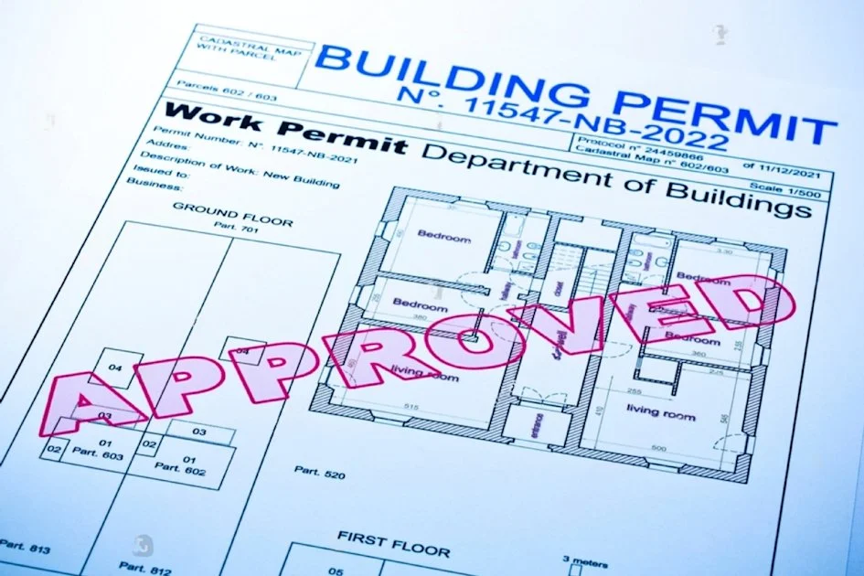 A building permit document with a floor plan and a large pink overlay reading 'APPROVED'.