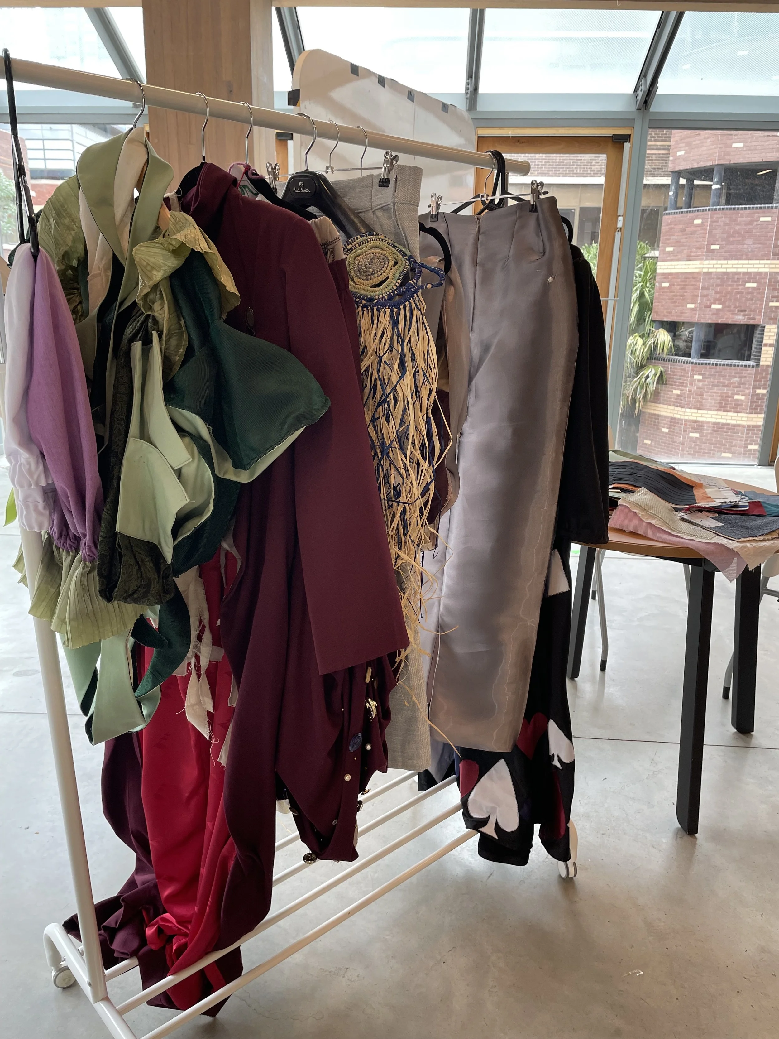 A rack of garments design by RMIT fashion students, featuring different textures.