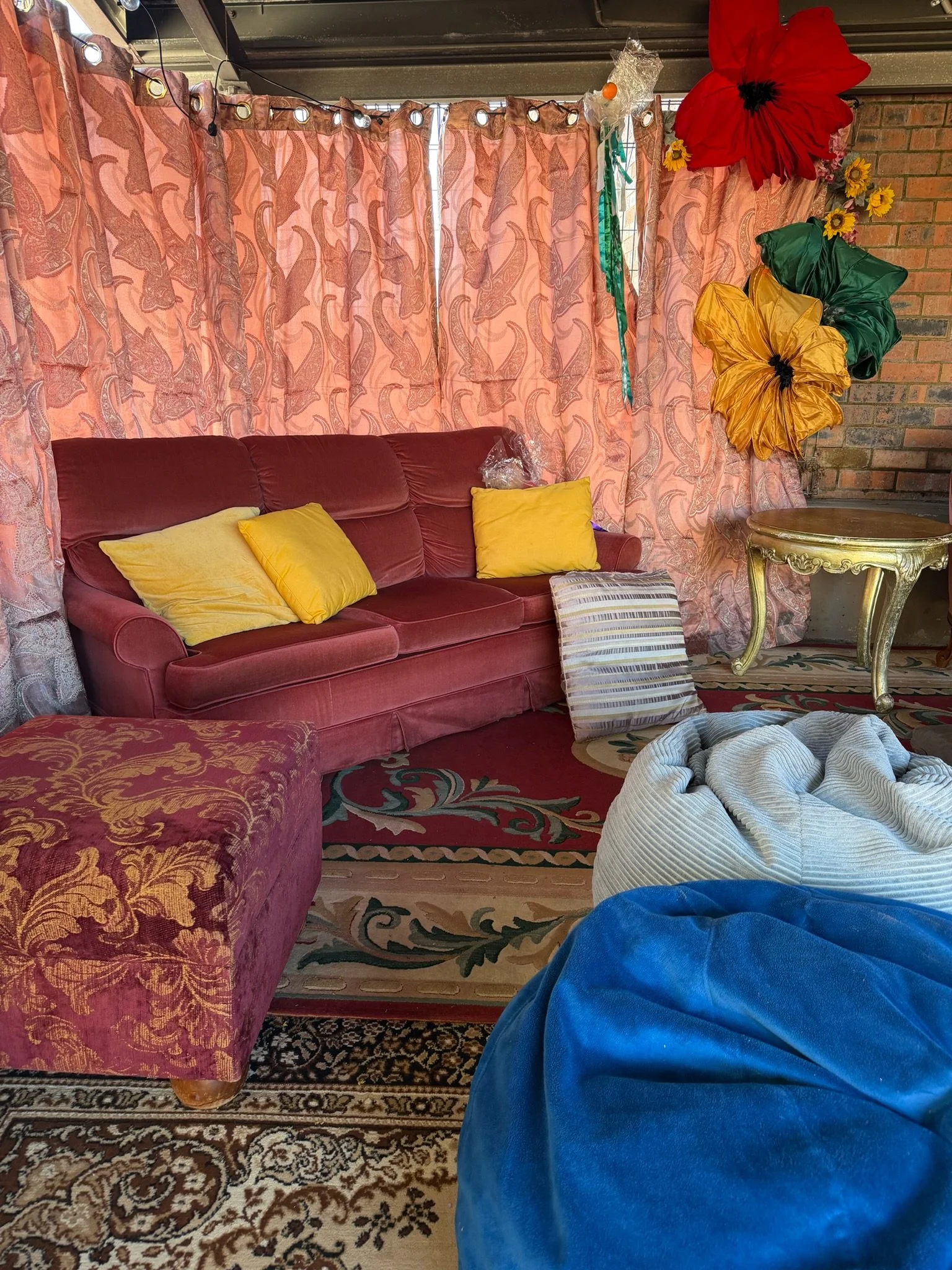Outdoor chill out zone at a party with rugs & couches