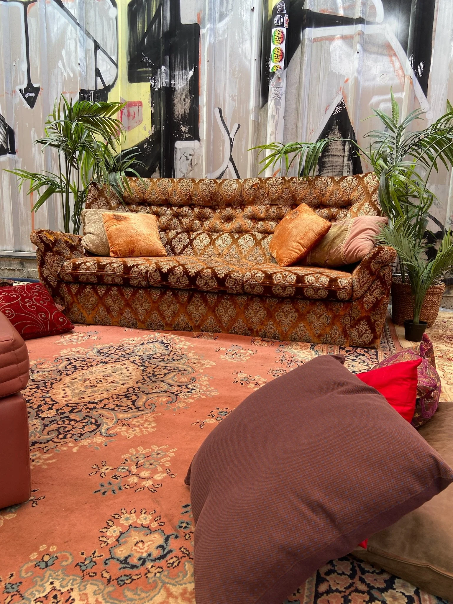 Outdoor chill out zone at a party with rugs & couches