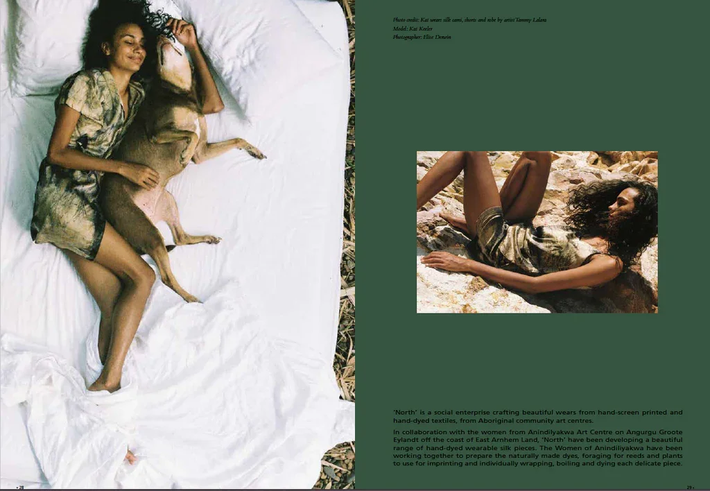 A woman and a dog lying on a white sheet, with the woman hugging the dog. Another woman is lying on rocks nearby, outdoors, wearing similar clothing.