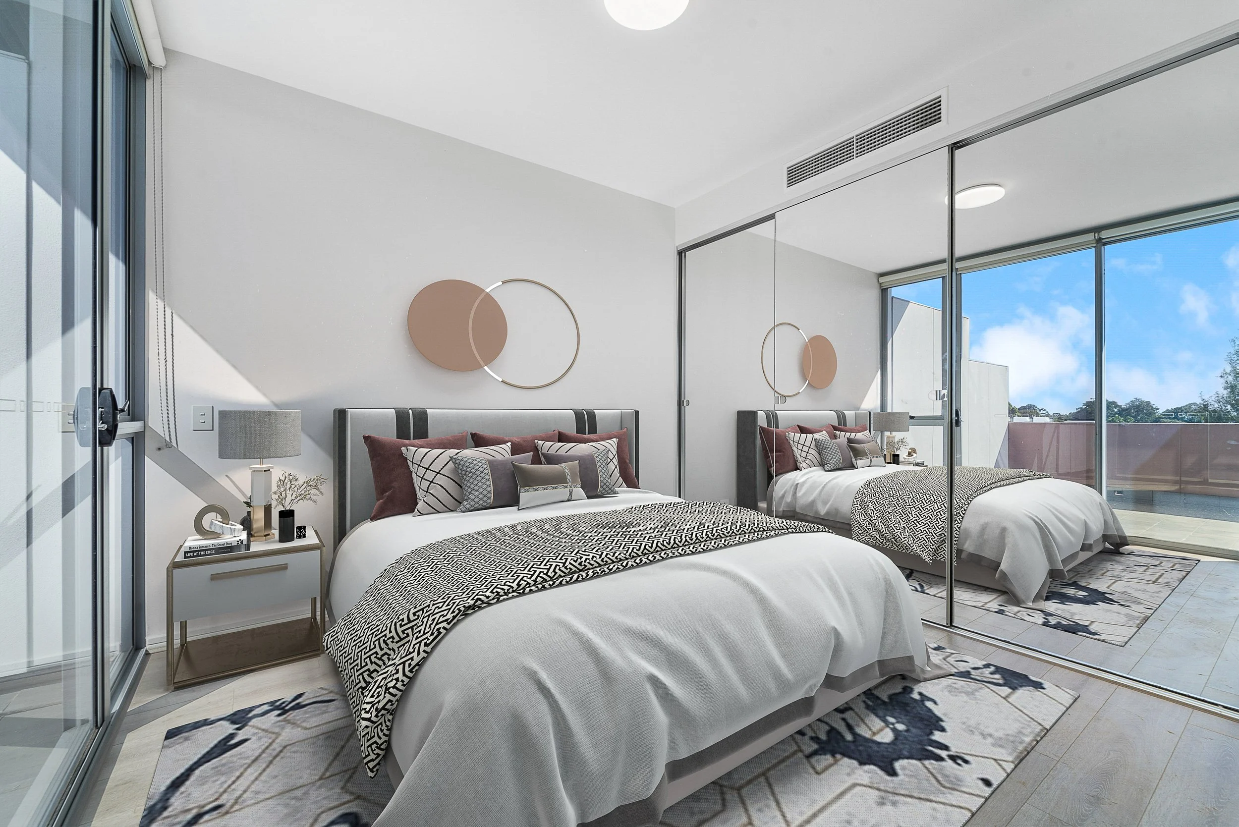 Modern bedroom with two beds, large mirror closet sliding doors, nightstand with lamp and decor, abstract wall art, and a balcony with glass doors showing a blue sky.