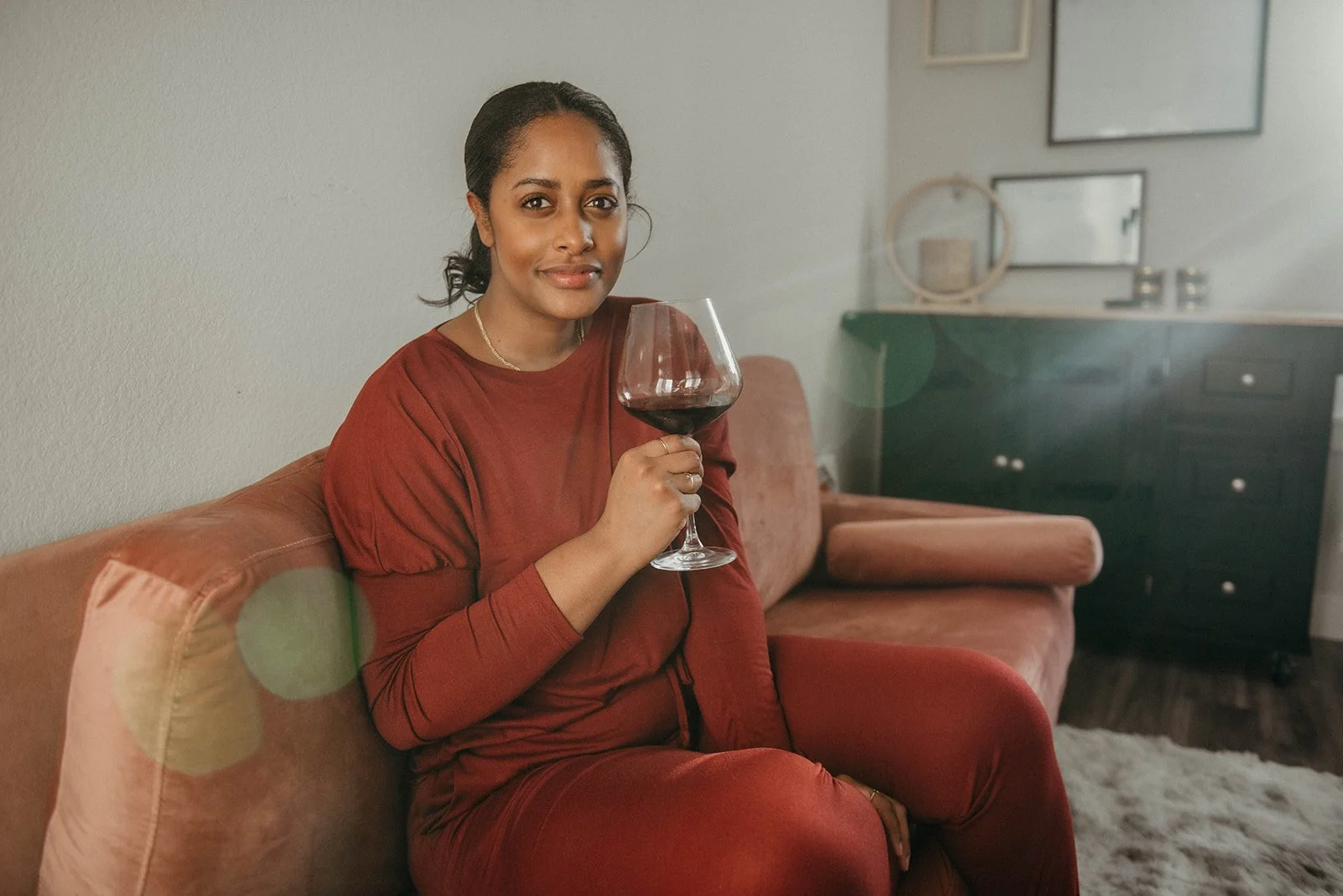 Kristin on pink couch