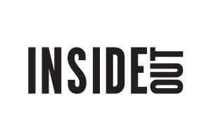 Close-up of a black t-shirt with the word 'INSIDE' and an EKG line design printed on it. The logo for Inside Out Magazine.