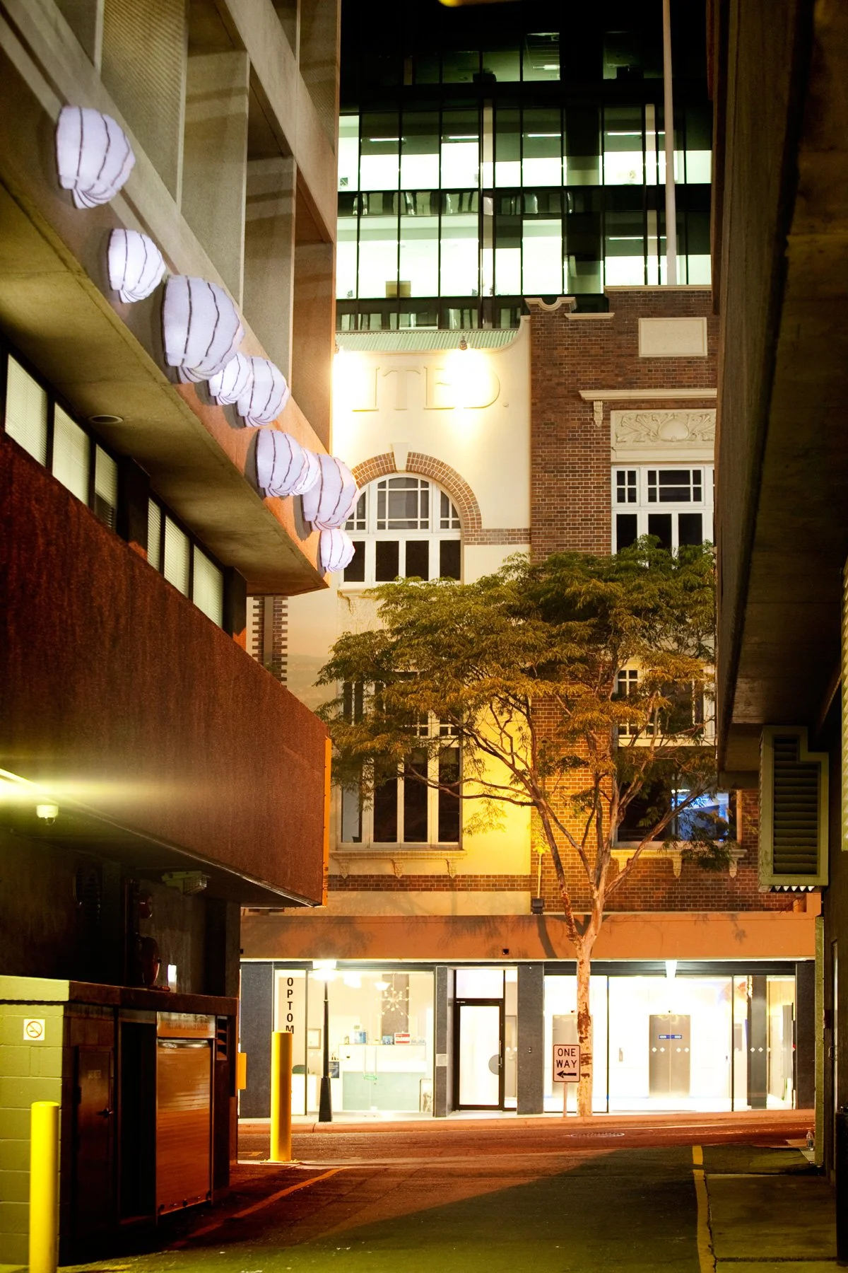 Briggs’ Lanterns by KT Doyle illuminated at night in Briggs Lane, Brisbane
