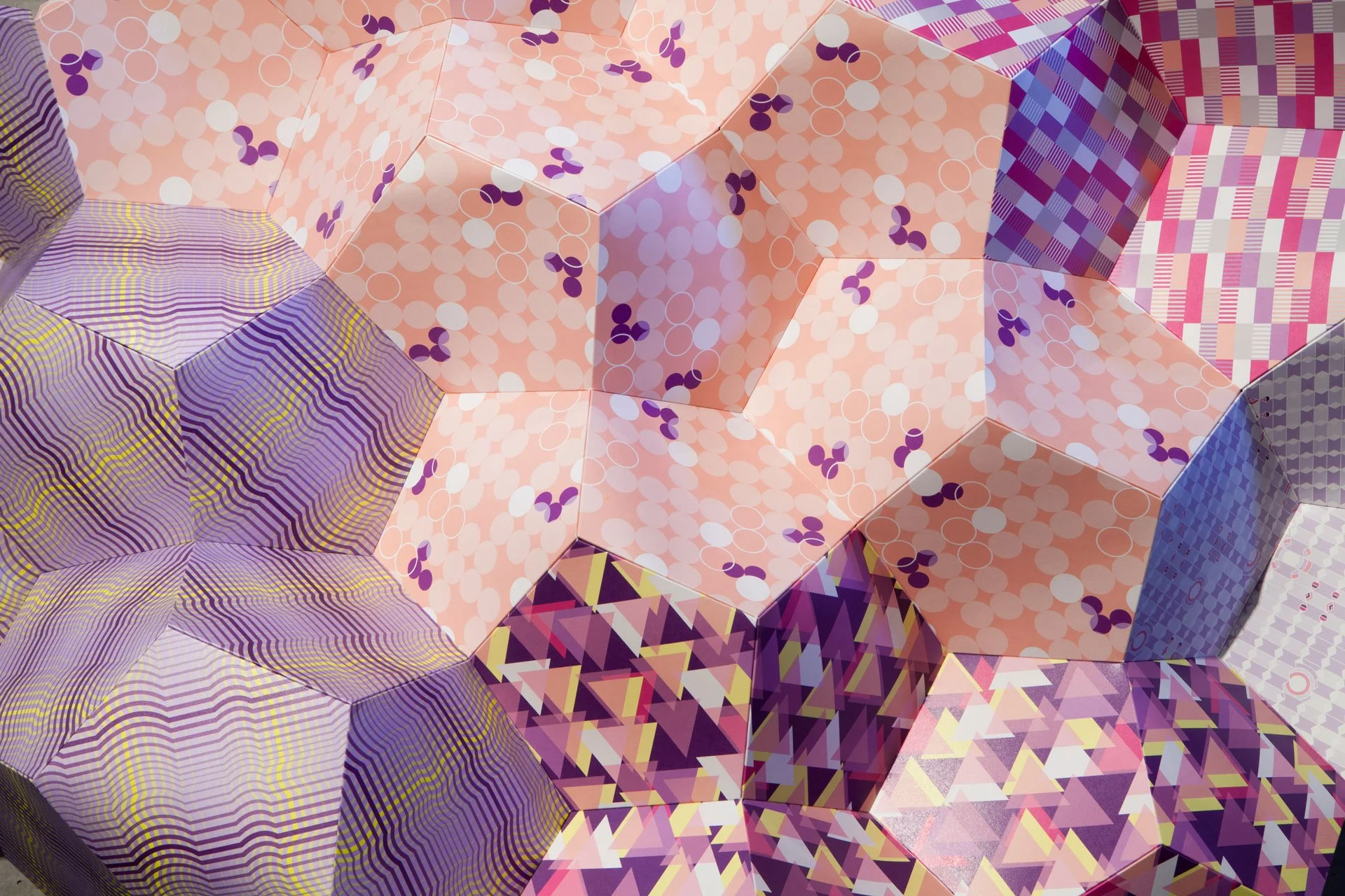 Detail of Stitched Together by KT Doyle and Robert Davidson showing interconnected faceted forms covered in contrasting geometric patterns