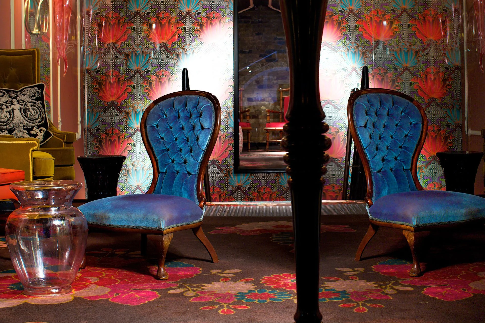 Laruche wallpaper by KT Doyle framing mirrored panels and blue velvet chairs inside Laruche Bar and Supper Club in Brisbane
