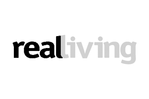 The word 'realliving' with 'real' in black and 'living' in gray. The logo for Real Living Magazine.