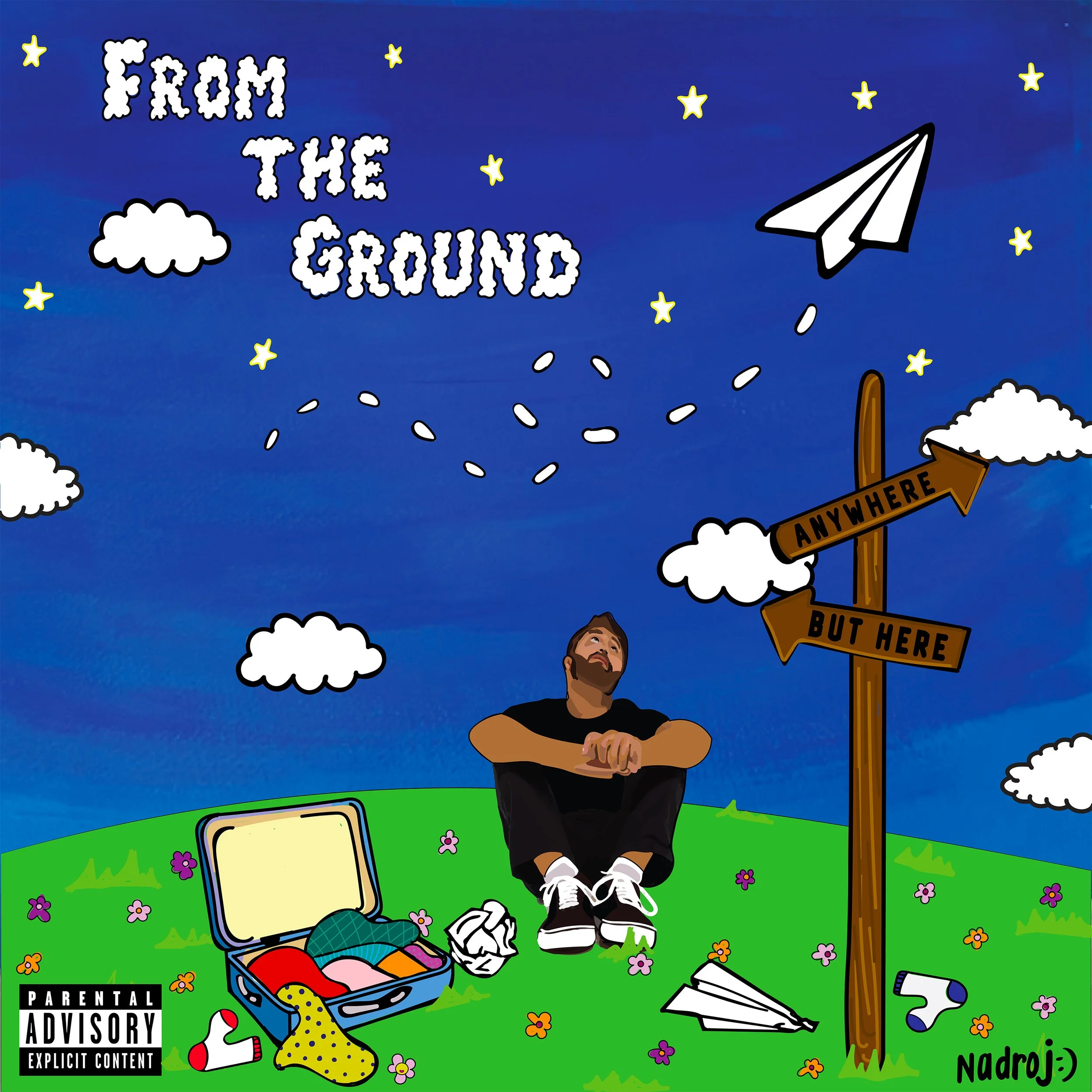 A cartoon illustration shows a man sitting on the ground next to an open suitcase with clothes around, looking up at a paper airplane in the sky. The background has a blue sky with stars and clouds, green hills, and a signpost with arrows labeled 'Anywhere' and 'But Here'. The text 'From the Ground' is written in cloud-shaped letters at the top.