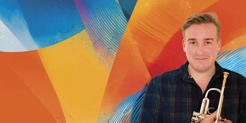 A man holding a trumpet stage left, standing in front of a colorful abstract background with shades of orange, blue, yellow, and red.
