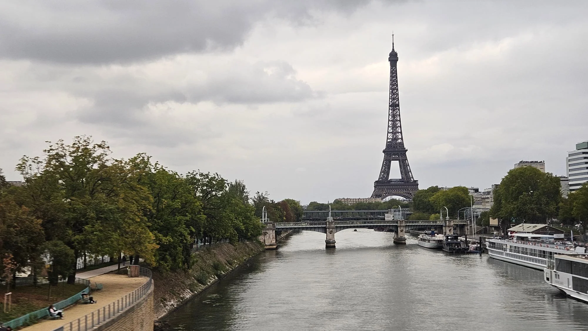 The iconic Eiffel Tower and Seine River in Paris featured as a premier dastination on the Sunrise Travel 'London & Paris: A Royal Holiday' hosted journey.