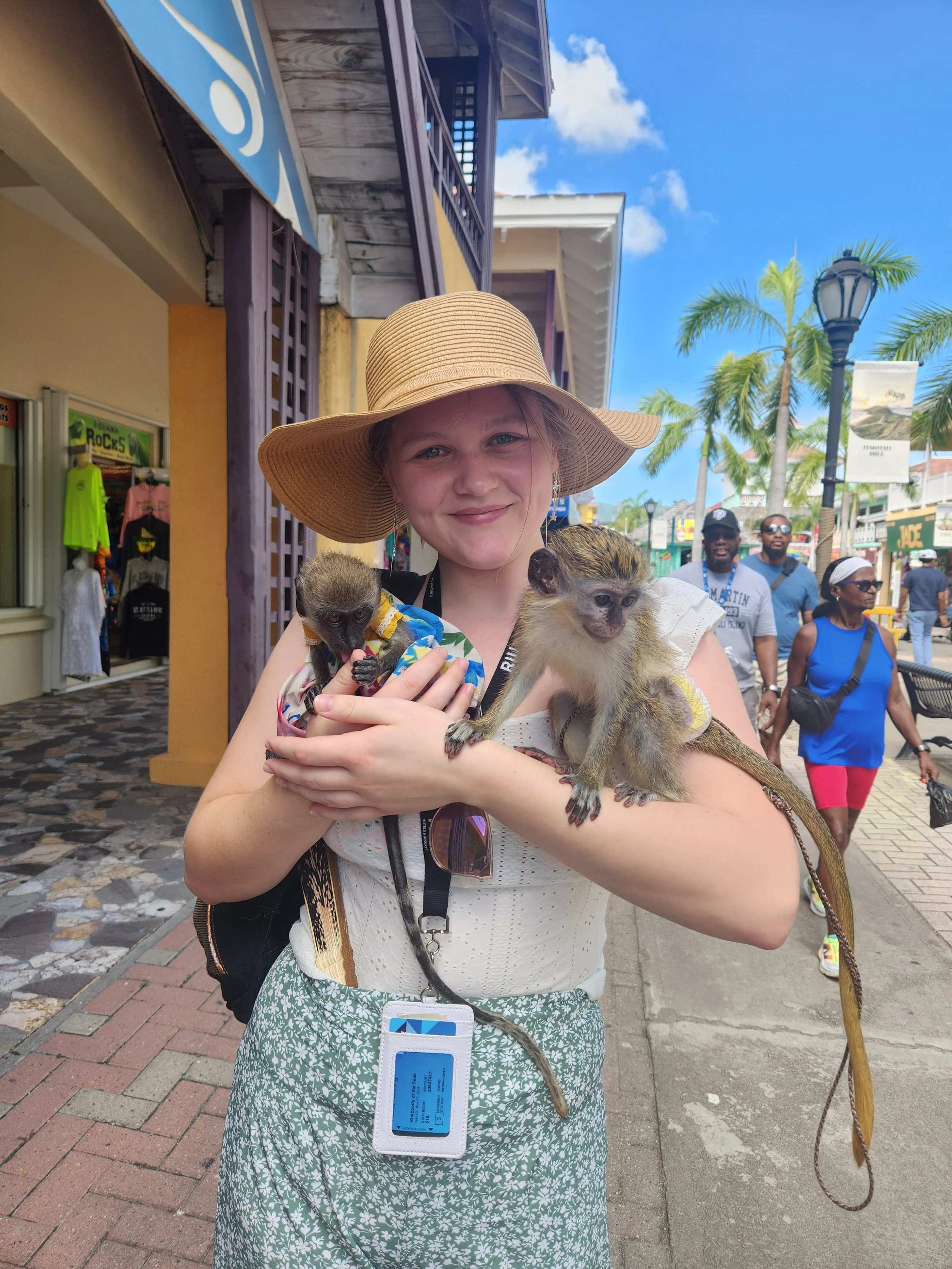 Alissa, a travel coordinator at Sunrise Travel, enjoying an excursion with monkeys on a Caribbean cruise.