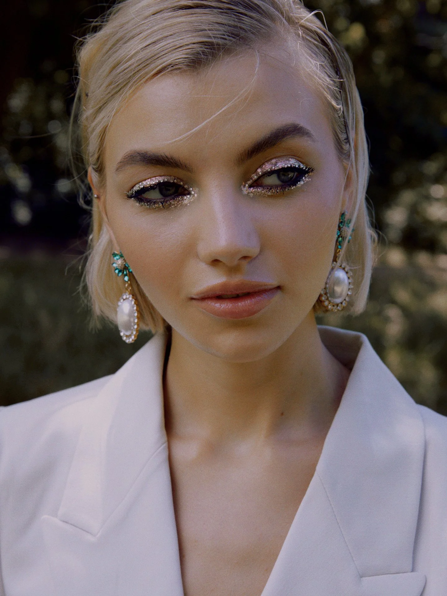 Close-up beauty look by Andrea van den Houten, showcasing technical precision and clean artistry for international fashion publications.