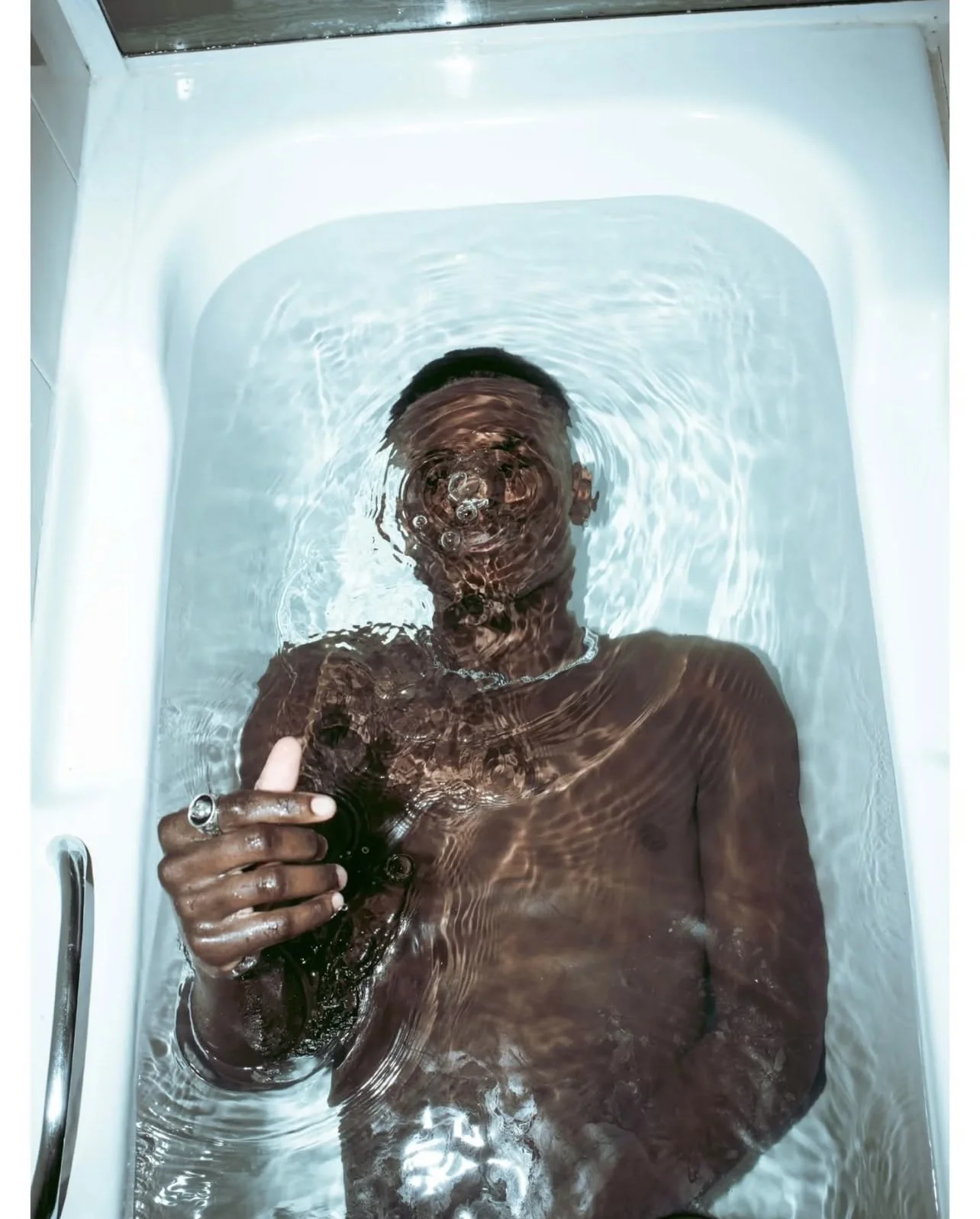 High-fashion beauty by Andrea van den Houten; a detailed study in luminous skin finish and professional editorial application.