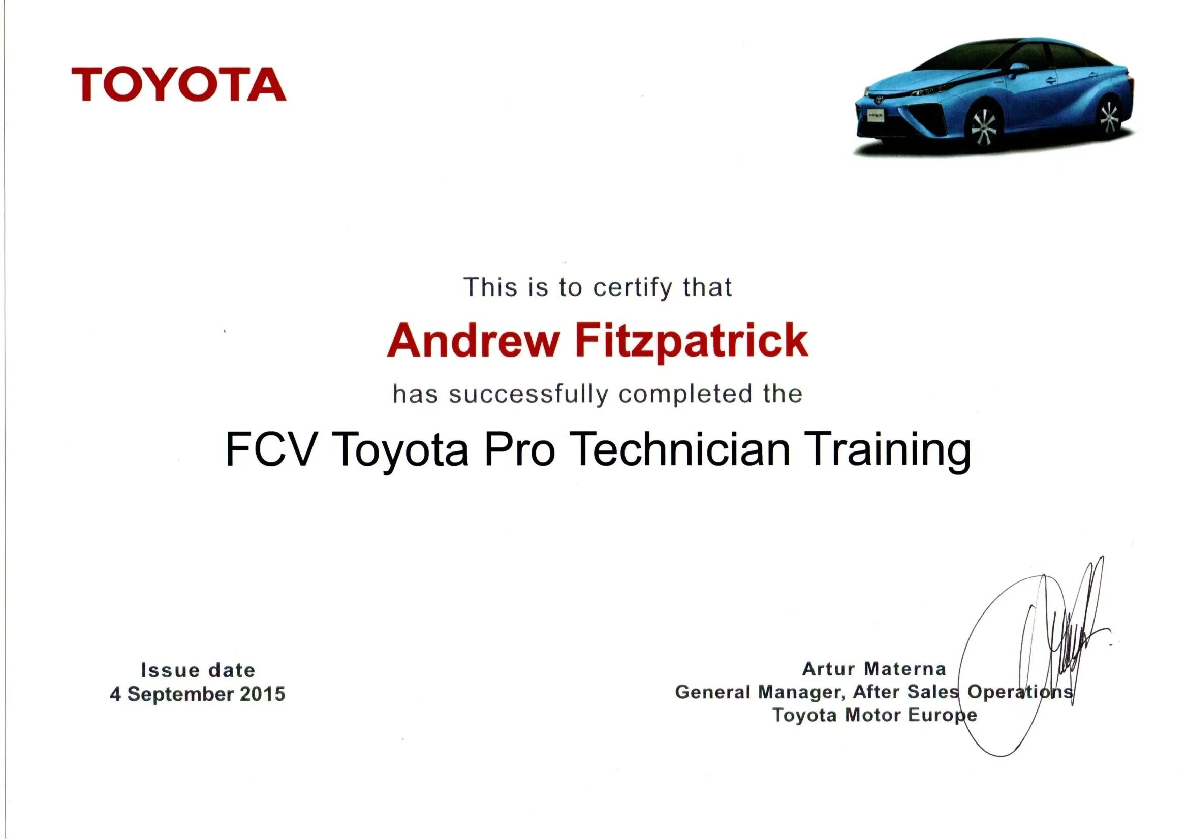 A certificate of completion from Toyota for Andrew Fitzpatrick, acknowledging his successful completion of the FCV Toyota Pro Technician Training, dated September 4, 2015, with a signature from Artur Materna, General Manager of After Sales Operations