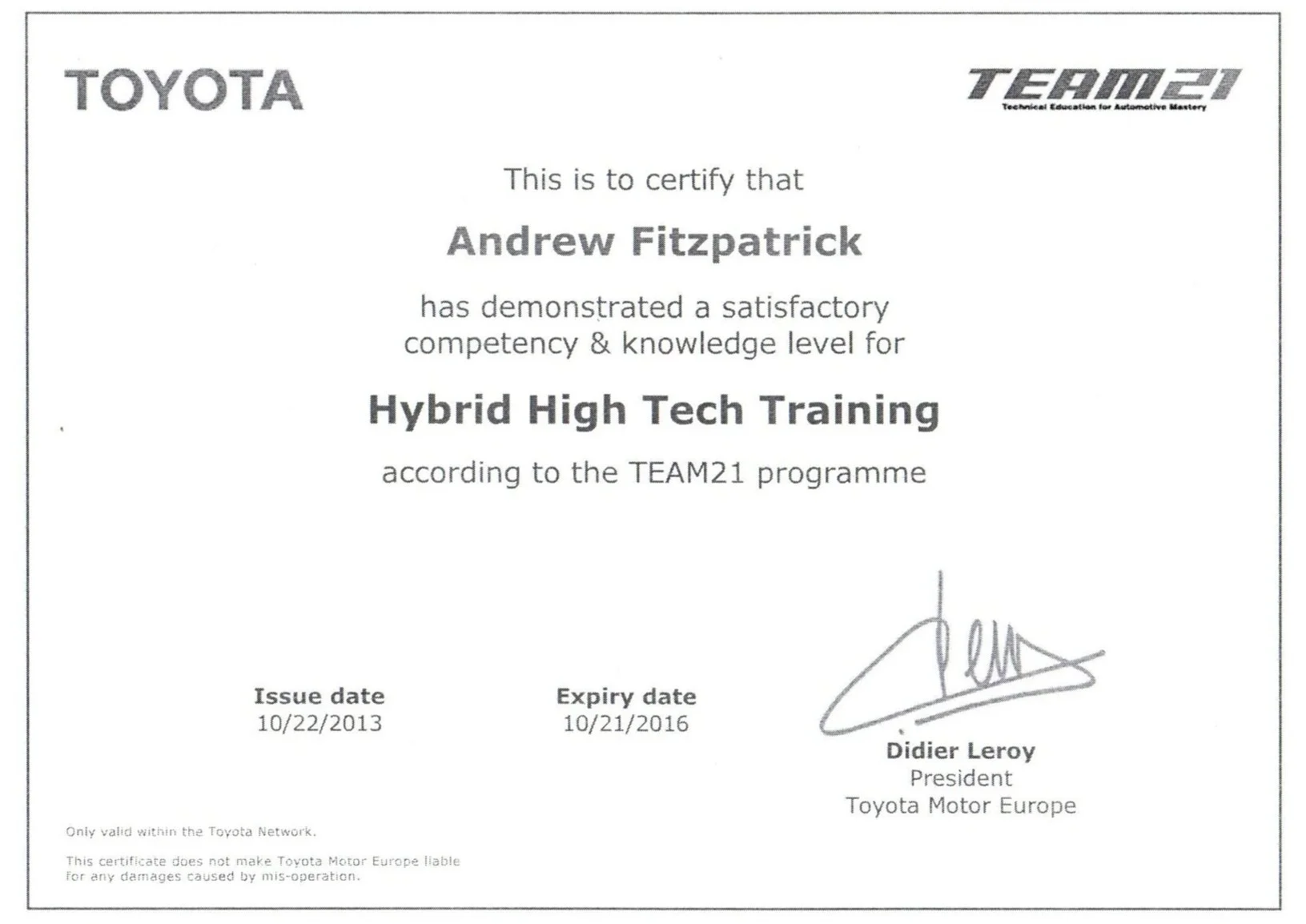 Certification document from Toyota and TEAM21 for Andrew Fitzpatrick in Hybrid High Tech Training, dated October 22, 2013, expiring October 21, 2016, signed by Didier Leroy, President of Toyota Motor Europe.