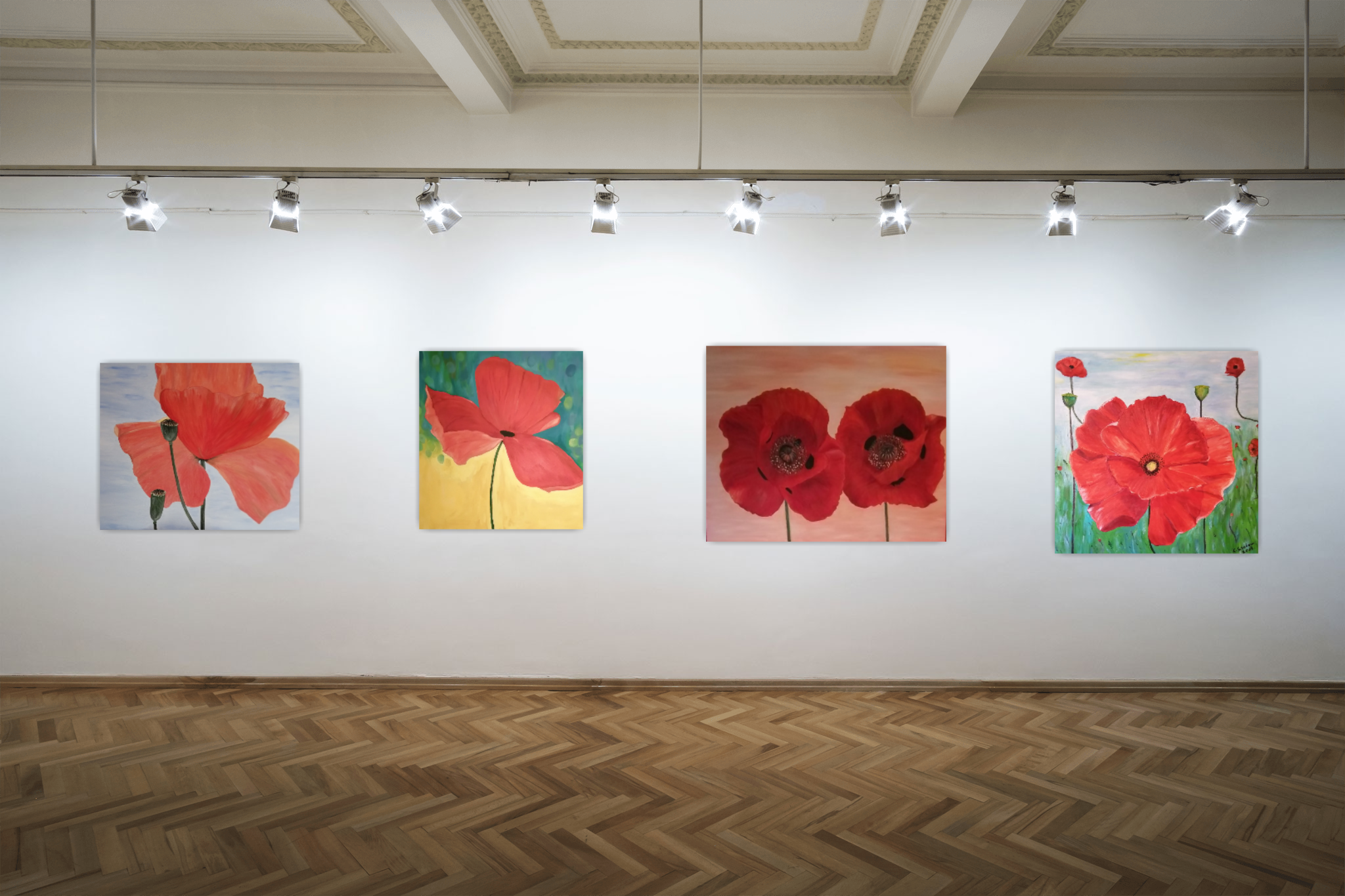 Four paintings of red poppies displayed on a white gallery wall with track lighting overhead.