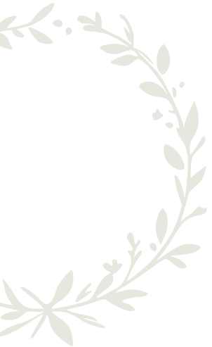 Green leafy wreath forming a partial circle on a black background.